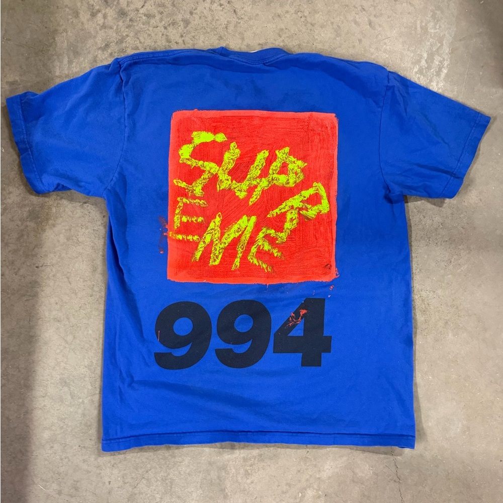 Supreme Blue Tee with Red and Yellow Graphic